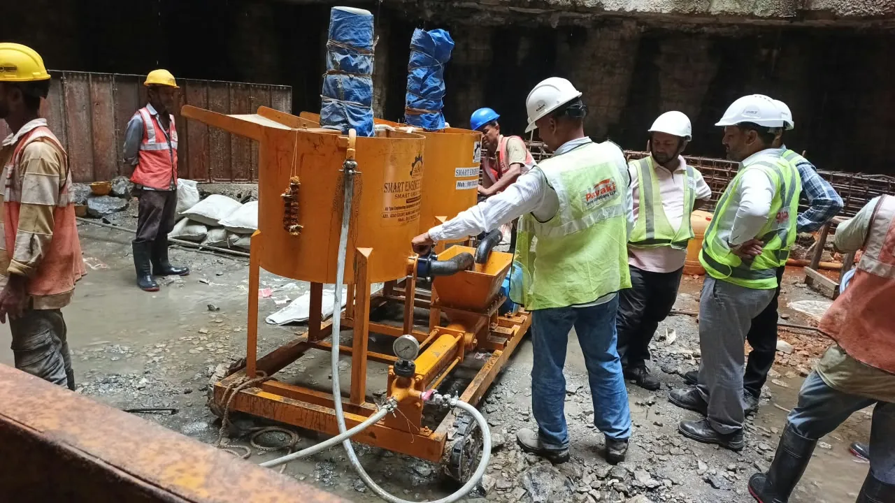 Pavaki engineers in hi-vis vests supervising a grout mixing plant inside a shaft in Mumbai