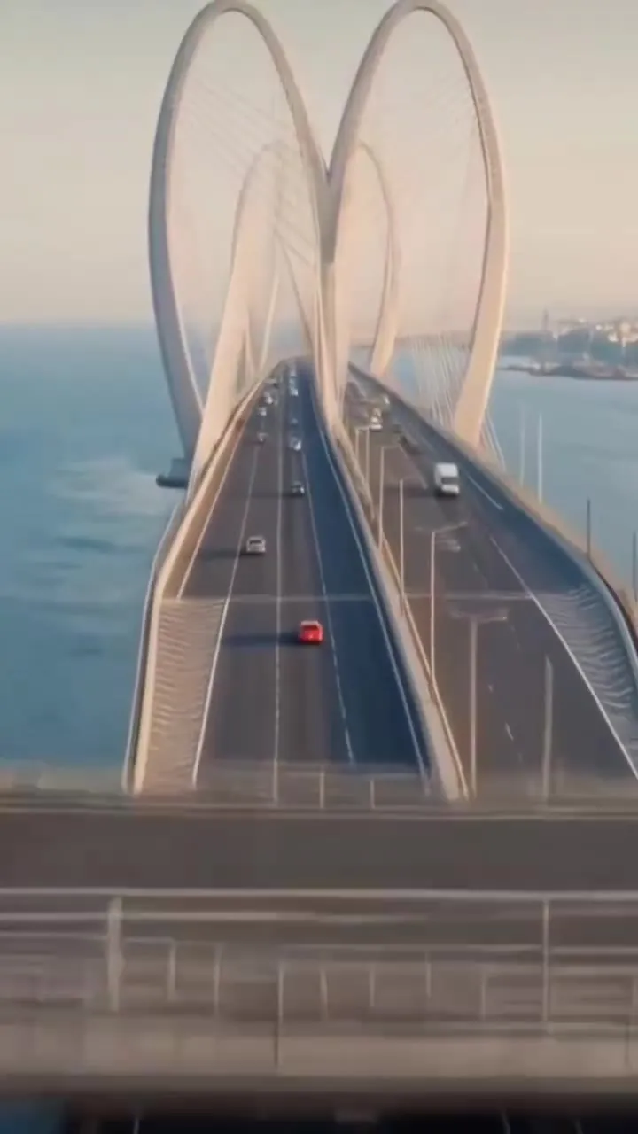 Aerial still of an arched sea bridge from the Versova–Bandra Sea Link reel
